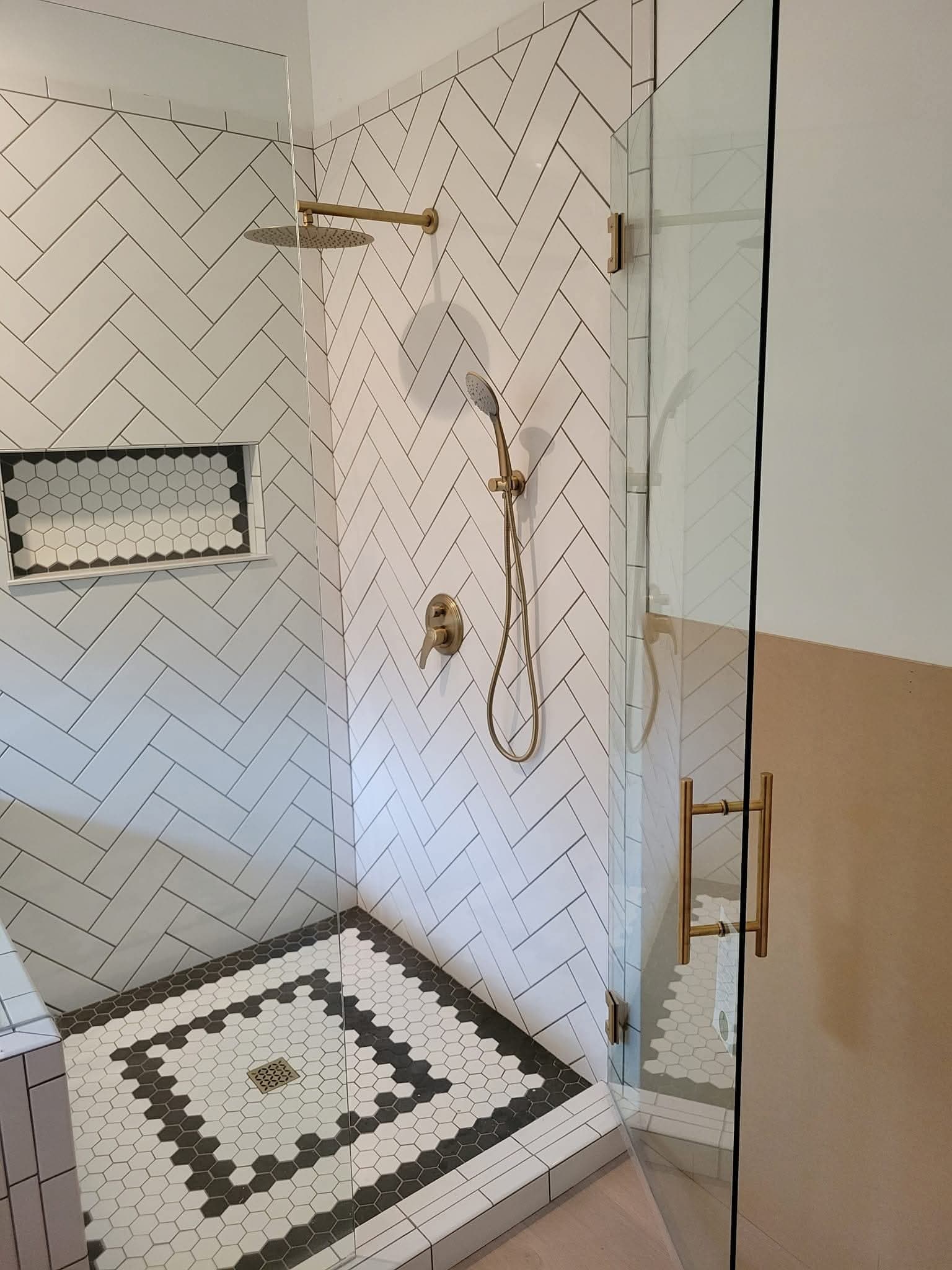 Marble shower, gold fixtures